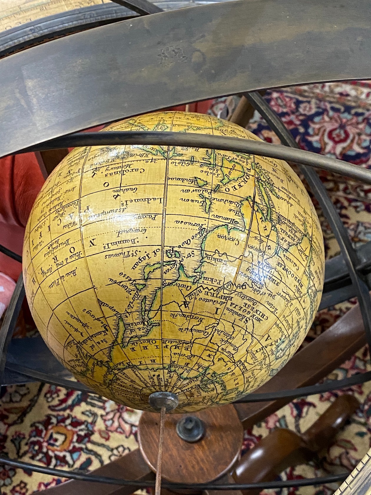 A reproduction bronzed metal mounted and mahogany globe on tripod stand, height 112cm